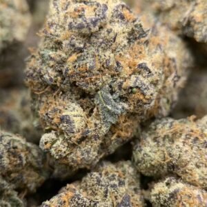 Home 7 Amaretto Exotic THCa Flower with dense, frosty buds and a sweet, nutty aroma