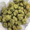 Apple Tartz THCa Flower with dense, frosty buds and a sweet, tart apple aroma
