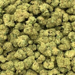 Grandi Guava THCa Flower buds on a white background, showcasing vibrant, colorful nugs with a sweet, tropical aroma