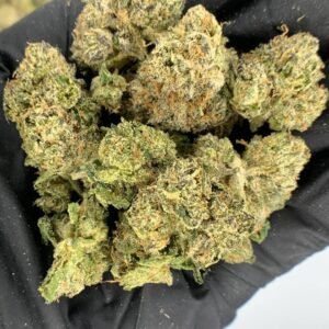Close-up of Airhead Runtz THCa Flower showcasing dense buds with frosty trichomes.